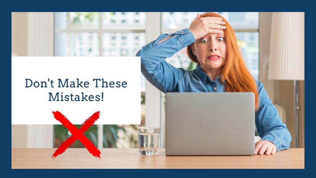 Woman holding her head in frustration while looking at her computer screen with an expression of shock because she made mistakes as a real estate developer