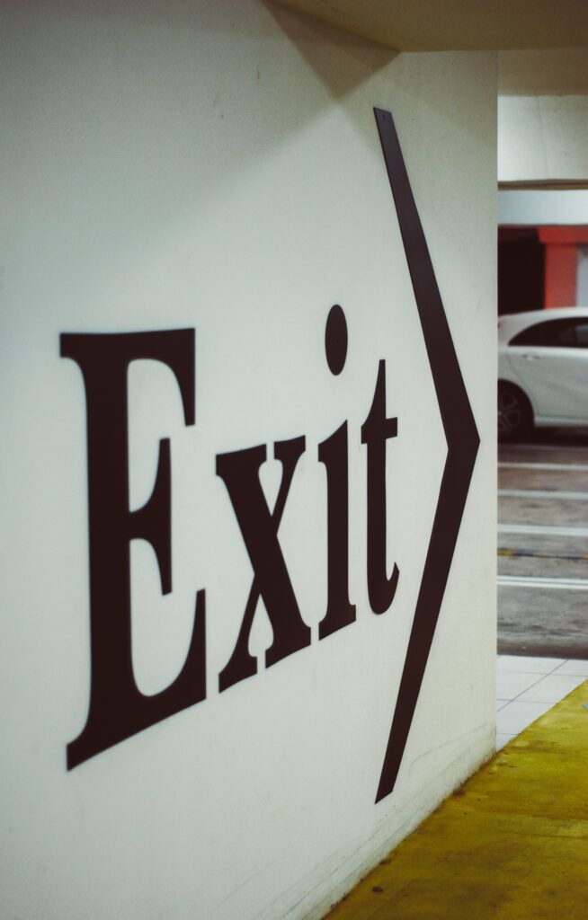 Exit sign leading to road for real estate investment in Jamaica