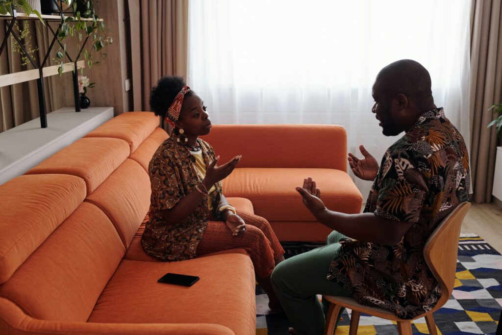 Black man and woman arguing about real estate investment decisions in Jamaica