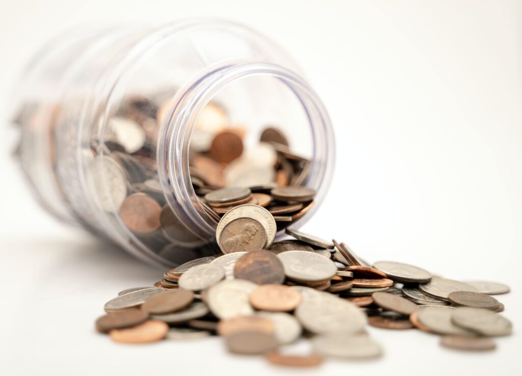 Pennies in an overturned jar demonstrating the affordability of buying a property in Jamaica